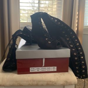 Thigh high lace up peep toe boot